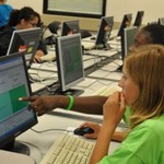 Green campers working on their web pages